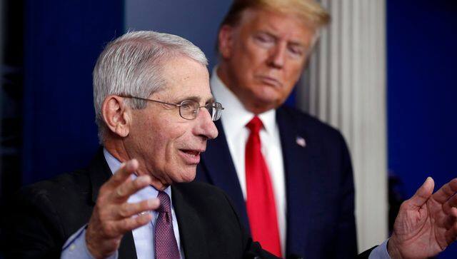 Donald Trump watched Anthony Fauci as he spoke about COVID-19 in 2020. AP