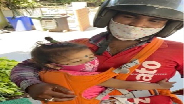 Delivery executive carries kids to work, Zomato says, will help out Delivery executive carries kids to work, Zomato says, will help out