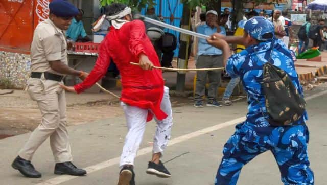 Security personnel baton charge to disperse protesters in Patna on Monday. PTI