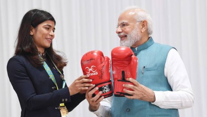Nikhat Zareen gifts PM Modi boxing gloves, Hima Das gives traditional 'gamocha'