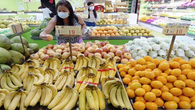 Customers buy fruit at a stall in Taipei, Taiwan. China has blocked imports of citrus and fish from Taiwan in retaliation for a visit to the self-ruled island by Nancy Pelosi. AP