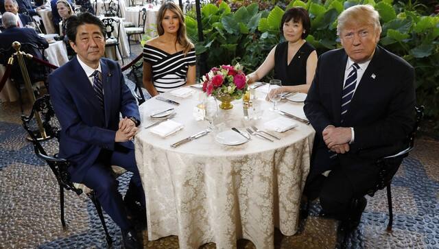 In 2018, then US president Donald Trump (R) and first lady Melania Trump sit down for dinner with Japan's then prime minister Shinzo Abe and his wife Akie at Trump's Mar-a-Lago estate. Reuters 