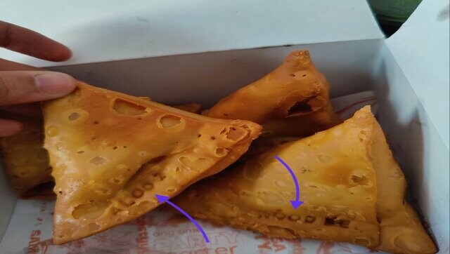 A man from Bangalore found a samosa with the filling name on it, see photos