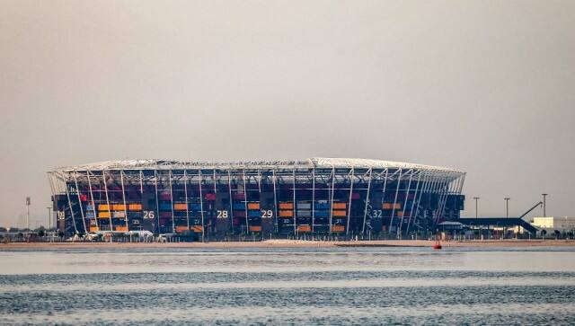 This picture taken early on August 4, 2022 from the Gulf waters off Qatar's capital Doha shows a view of 974 Stadium, formerly knows as Ras Abu Aboud, which will host matches of the FIFA football World Cup 2022. - Qatar on August 12 marks 100 days remaining until the start of the 2022 FIFA World Cup. (Photo by MUSTAFA ABUMUNES / AFP)