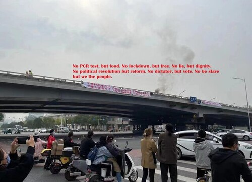 Tiananmen Square 2.0: Man protests with banners, calling on loudspeaker to ‘strike the dictator’ Xi Jinping Tiananmen Square 2.0: Man protests with banners, calling on loudspeaker to ‘strike the dictator’ Xi Jinping