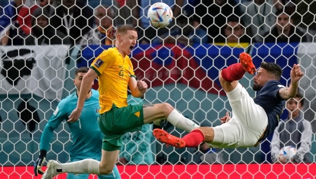 France's Olivier Giroud, right, goes for scissors kick by Australia's Kye Rowles during the World Cup group D soccer match between France and Australia, at the Al Janoub Stadium in Al Wakrah, Qatar, Friday, Nov. 4, 2022. (AP Photo/Frank Augstein)