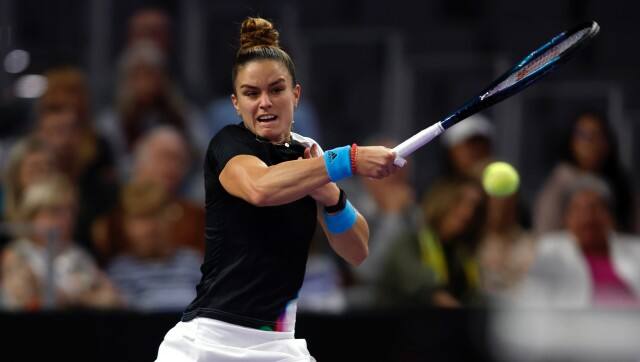 Maria Sakkari of Greece returns a volley from Aryna Sabalenka of Belarus in the second set of their match during round-robin play on day three of the WTA Finals tennis tournament in Fort Worth, Texas, Wednesday, Nov. 2, 2022. Sakkari won 6-2, 6-4. (AP Photo/Tim Heitman)