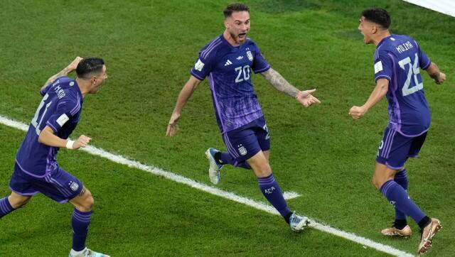 Argentina's Alexis Mac Allister, center, celebrates after scoring his side's opening goal during the World Cup group C soccer match between Poland and Argentina at the Stadium 974 in Doha, Qatar, Wednesday, Nov. 30, 2022. (AP Photo/Hassan Ammar)
