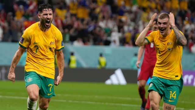 Australia’s Mathew Leckie, left, celebrates with his teammate Riley McGree after scoring his side’s first goal during the World Cup group D soccer match between Australia and Denmark, at the Al Janoub Stadium in Al Wakrah, Qatar, Wednesday, Nov. 30, 2022. (AP Photo/Thanassis Stavrakis)