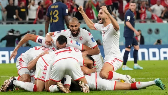 Players of Tunisia celebrate after Wahbi Khazri scored their side’s opening goal against France during a World Cup group D soccer match at the Education City Stadium in Al Rayyan, Qatar, Wednesday, Nov. 30, 2022. (AP Photo/Martin Meissner)