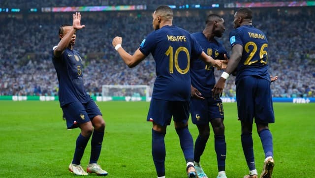 France’s Kylian Mbappe celebrates with teammates scoring from the penalty spot his side’s third goal during the World Cup final soccer match between Argentina and France at the Lusail Stadium in Lusail, Qatar, Sunday, Dec. 18, 2022. (AP Photo/Natacha Pisarenko)