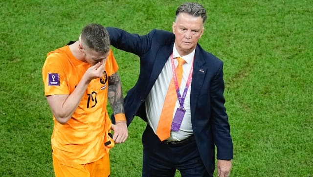 Wout Weghorst, left, is consoled by head coach Louis van Gaal of the Netherlands, at the end of the World Cup quarterfinal soccer match between the Netherlands and Argentina, at the Lusail Stadium in Lusail, Qatar, Saturday, Dec. 10, 2022. (AP Photo/Ariel Schalit)