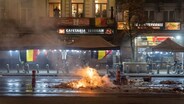 Sacre Bleu! Clashes break out in France and Brussels after Morocco's FIFA World Cup defeat
