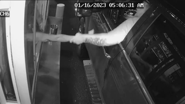 Watch: Man attempts to pull barista out of drive-through window; arrested