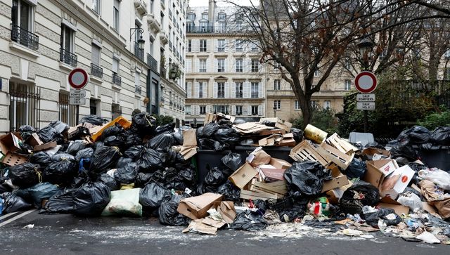 Why are streets in France littered with heaps of garbage?