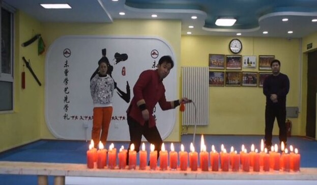 Chinese man extinguishes 42 candles with single crack of whip; watch video Chinese man extinguishes 42 candles with single crack of whip; watch video