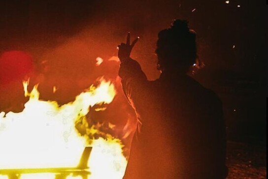 Iran protesters return to streets during fire festival, burn hijabs & Khamenei's posters