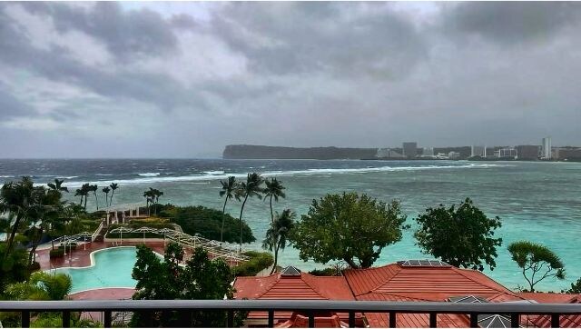 Rain, winds lash Guam as Typhoon Mawar closes in and residents shelter