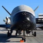 China's 'secretive' spacecraft returns to Earth after 9 months orbital mission