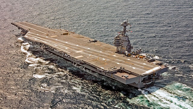 (File) A US Navy F/A-18F Super Hornet approaches the USS Gerald R Ford to use the new AAG arrested landing system in the Atlantic Ocean. Reuters