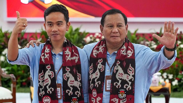 (File) Presidential candidate Prabowo Subianto, right, and his running mate Gibran Rakabuming Raka, the eldest son of President Joko Widodo, wave at the media after registering their candidacy to run in the 2024 election, at the General Election Commission building in Jakarta on 25 October, 2023. AP