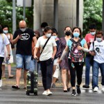 Singapore sees COVID-19 peak, medical professionals vigilant for potential surge