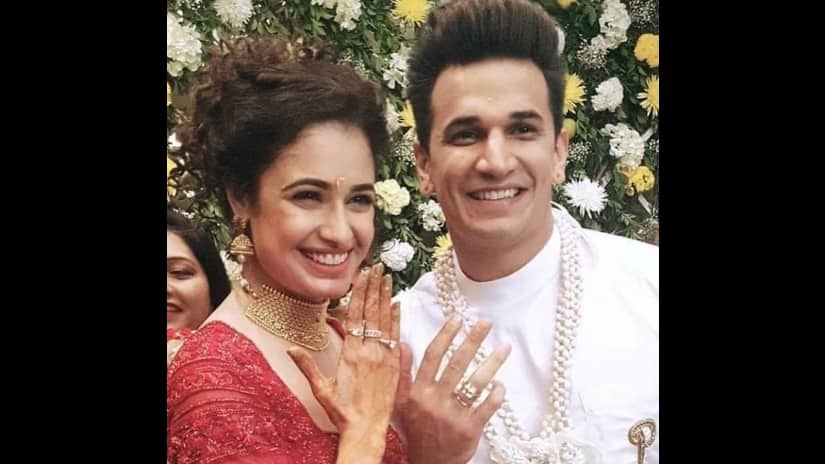 Yuvika and Price pose with their engagement rings. Image via Twitter