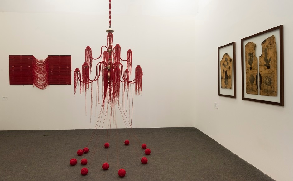 Installation view of Monali Meher's 'Wrapped Bridal Photos from 2005' (left), ‘Auspiciously Red III’ (centre) and ‘Blumen Mantel (Flower Coat)’ (right) Installation view of Monali Meher's 'Wrapped Bridal Photos from 2005' (left), ‘Auspiciously Red III’ (centre) and ‘Blumen Mantel (Flower Coat)’ (right)