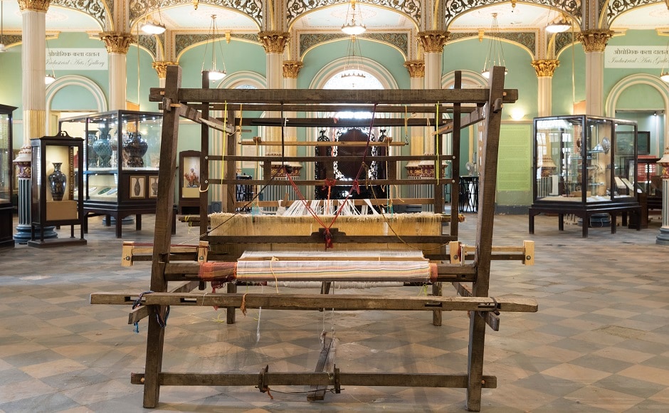 Installation view of Sharmila Samant's 'Bombay Weaves', 2018, Handloom, 50 spindles. Textiles both as practice and form are inextricably linked to complex histories of legitimation and hegemony, colonial trade, industry, and the freedom movement. It defines culture through the relationship between body and cloth, selfhood, attires and identities and fashion. Installation view of Sharmila Samant's 'Bombay Weaves', 2018, Handloom, 50 spindles. Textiles both as practice and form are inextricably linked to complex histories of legitimation and hegemony, colonial trade, industry, and the freedom movement. It defines culture through the relationship between body and cloth, selfhood, attires and identities and fashion.