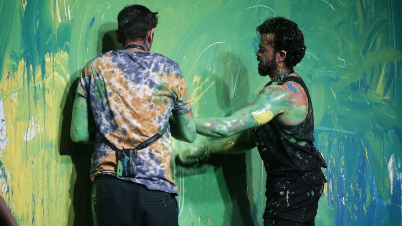 Sreesanth and Romil painting walls