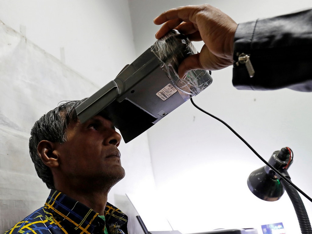 A man goes through the process of eye scanning for the Unique Identification (UID) database system, Aadhaar, at a registration centre in New Delhi, India. Image: Reuters