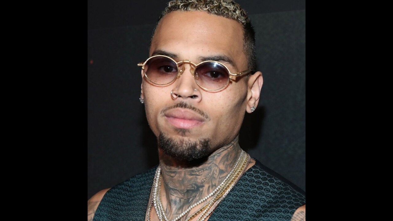 Chris Brown detained by Paris police after 24-year-old woman accuses singer of rape