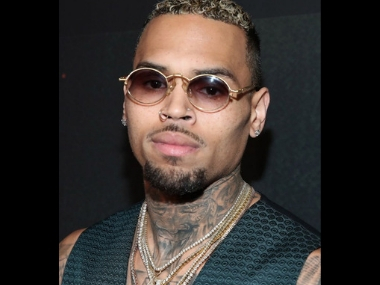Chris Brown detained by Paris police after 24-year-old woman accuses singer of rape Chris Brown detained by Paris police after 24-year-old woman accuses singer of rape