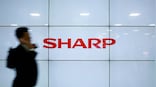Sharp cut its full-year outlook, citing US-China trade frictions and weaker demand