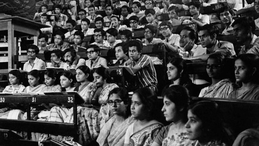 Still from Ray's Pratidwandi depicting Siddhartha's crammed classroom