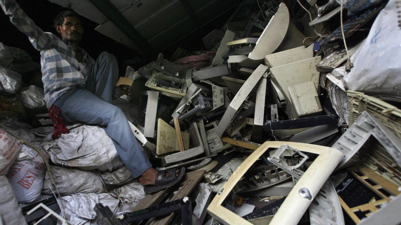Scrap dealer in Mumbai sitting atop ewaste. Image: Reuters