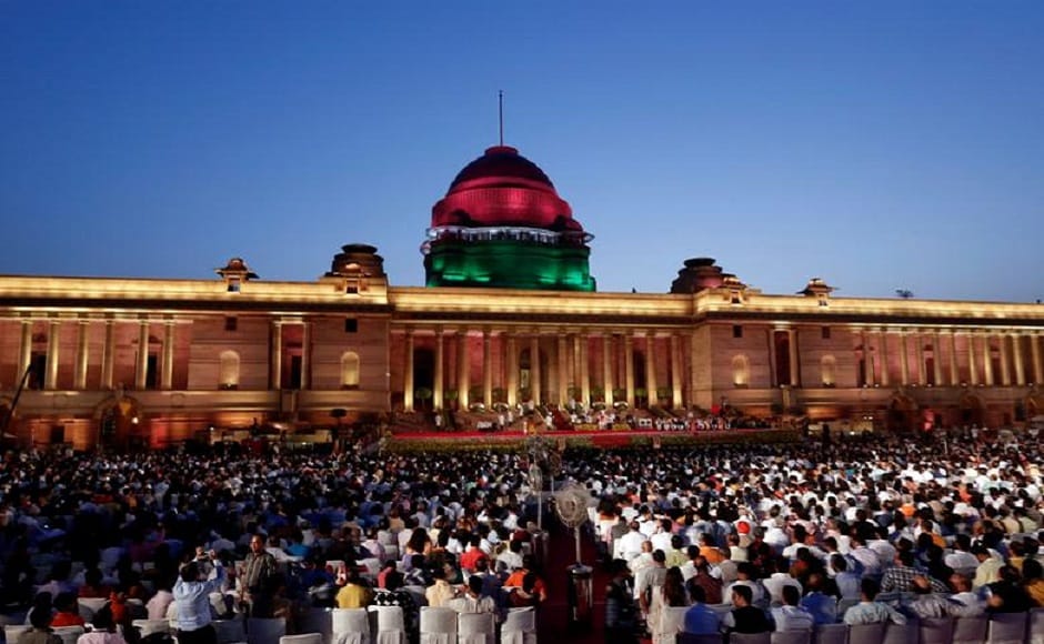As the sun set over the Rashtrapati Bhavan, the two-hour swearing-in ceremony commenced with 8,000 people packing into the forecourt of the historic British-era presidential palace. In a grand ceremony with overtones of a US presidential inauguration, heads of state and government, chief ministers, India Inc honchos, opposition leaders, BJP members and showbiz stars rubbed shoulders as they watched President Kovind administer the oath of office. PTI