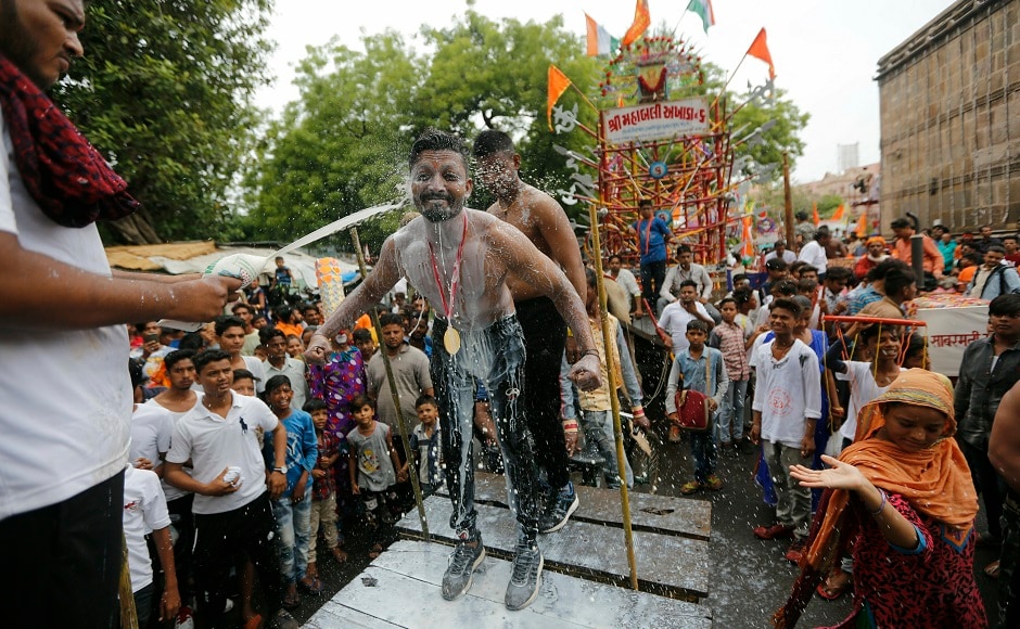 Processions similar to the Jagannath Yatra in Puri are held in different parts of India such as Ahmedabad and Kolkata, on the same day. In the above image, a man pours milk on a bodybuilder as they participate at an annual Rath Yatra in Ahmadabad. AP Processions similar to the Jagannath Yatra in Puri are held in different parts of India such as Ahmedabad and Kolkata, on the same day. In the above image, a man pours milk on a bodybuilder as they participate at an annual Rath Yatra in Ahmadabad. AP