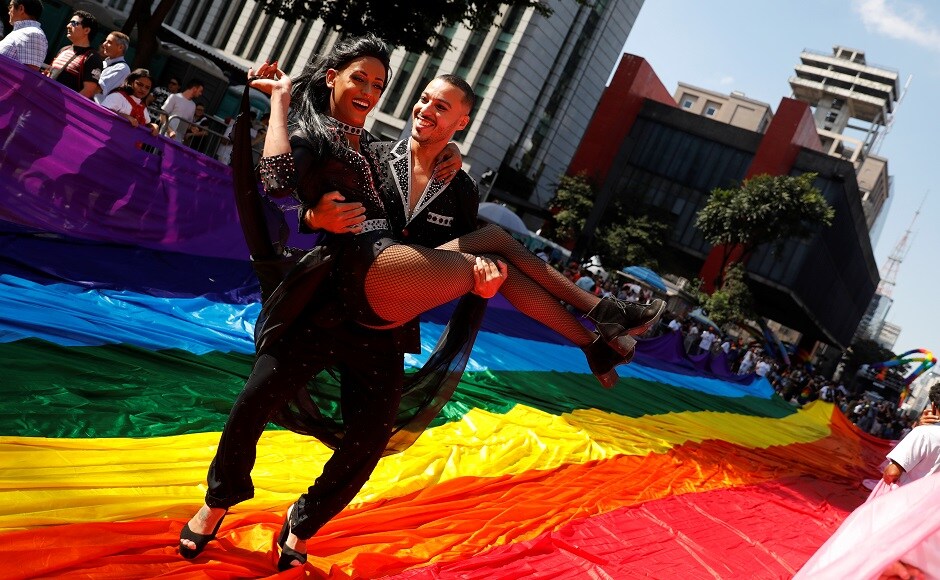 Participants dance during the Gay Pride parade along Paulista Avenue in Sao Paulo, Brazil on 23 June, 2019. Reuters/Nacho Doce Participants dance during the Gay Pride parade along Paulista Avenue in Sao Paulo, Brazil on 23 June, 2019. Reuters/Nacho Doce