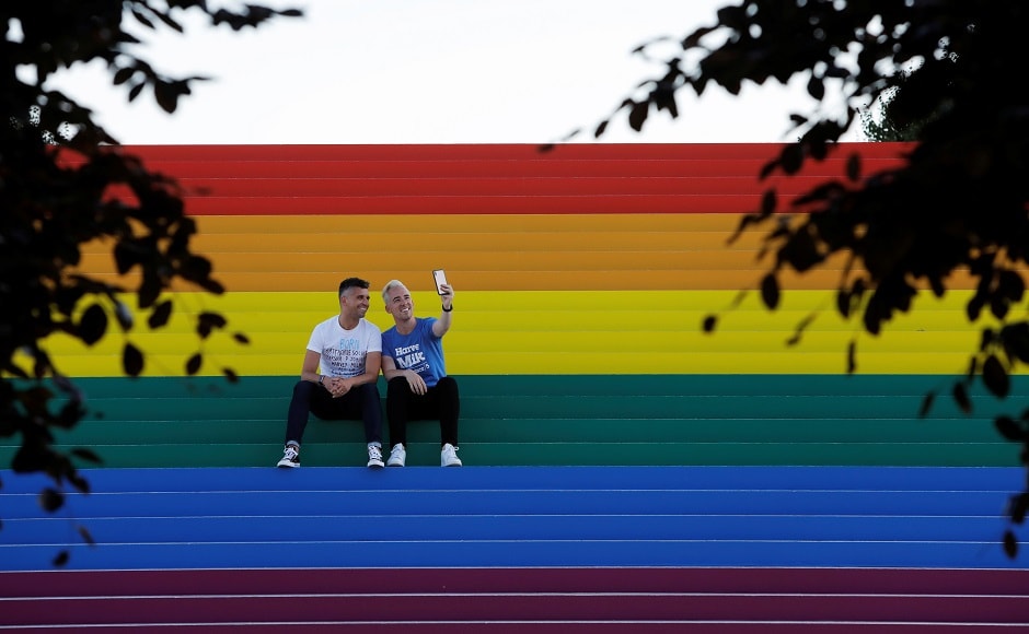 Mark Seeley and Ryan Hallett, who were married in New York State in 2015, take a selfie on a giant LGBTQ Pride Flag installed on the steps of Franklin D. Roosevelt Four Freedoms State Park to celebrate WorldPride in New York City, US on 14 June, 2019. Reuters/Andrew Kelly Mark Seeley and Ryan Hallett, who were married in New York State in 2015, take a selfie on a giant LGBTQ Pride Flag installed on the steps of Franklin D. Roosevelt Four Freedoms State Park to celebrate WorldPride in New York City, US on 14 June, 2019. Reuters/Andrew Kelly