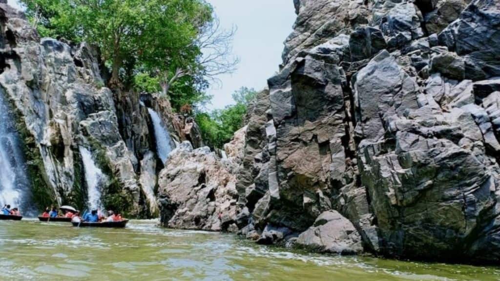 Tourists paddling coracles at the Hoggenakkal falls. Photo by KA Shaji.