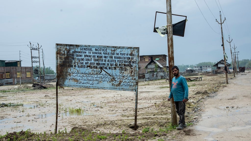 Government signboards indicating that the plots of land cannot be resold or sublet to non-Dal dwellers. Photo by Jennifer Kishan
