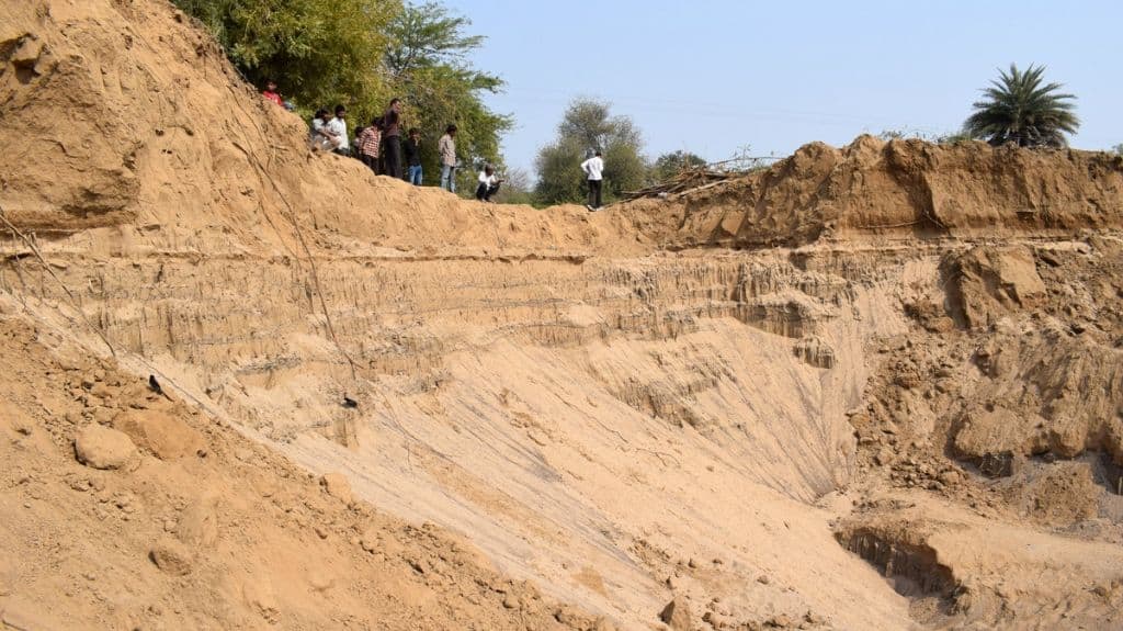 Excessive sand mining at the banks of Narmada has destroyed the river bed and catchment area, affecting the fish population. Photo by Hridayesh Joshi.