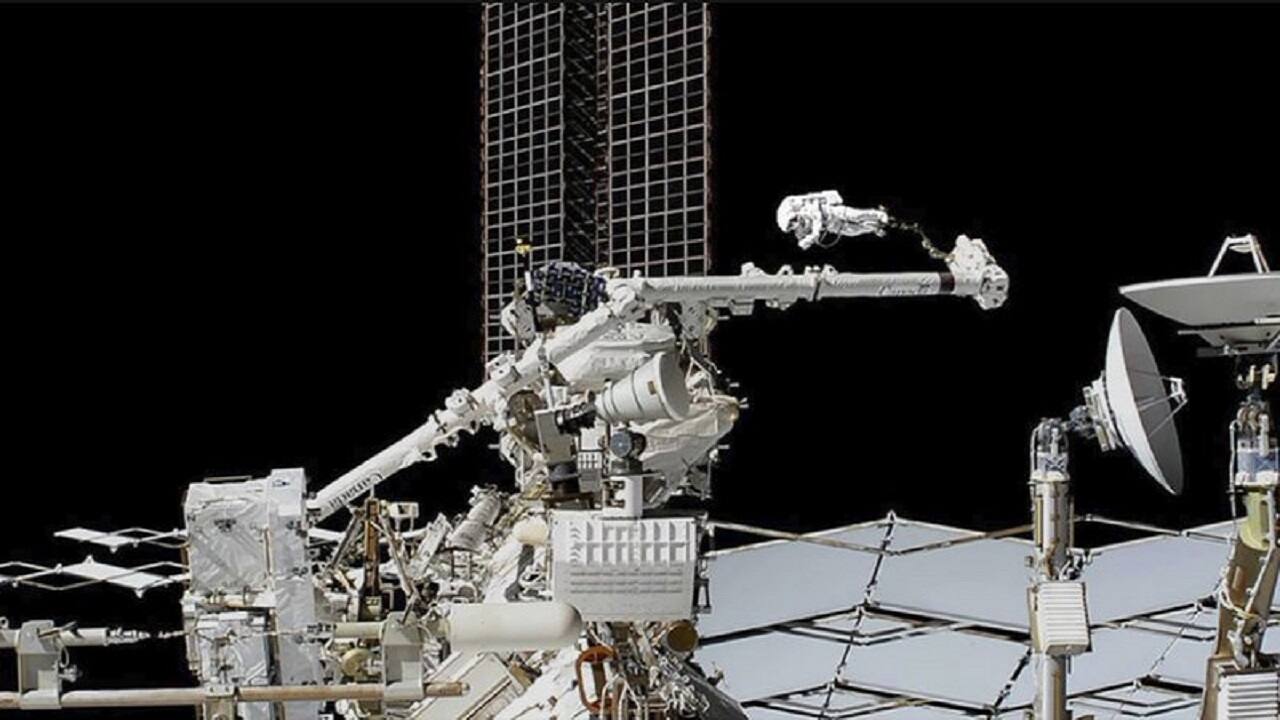 In this photo provided by NASA, astronaut Luca Parmitano is guided on the Canadarm2 robotic arm toward the work site on the Alpha Magnetic Spectrometer, the space station’s cosmic particle detector at the International Space Station. AP