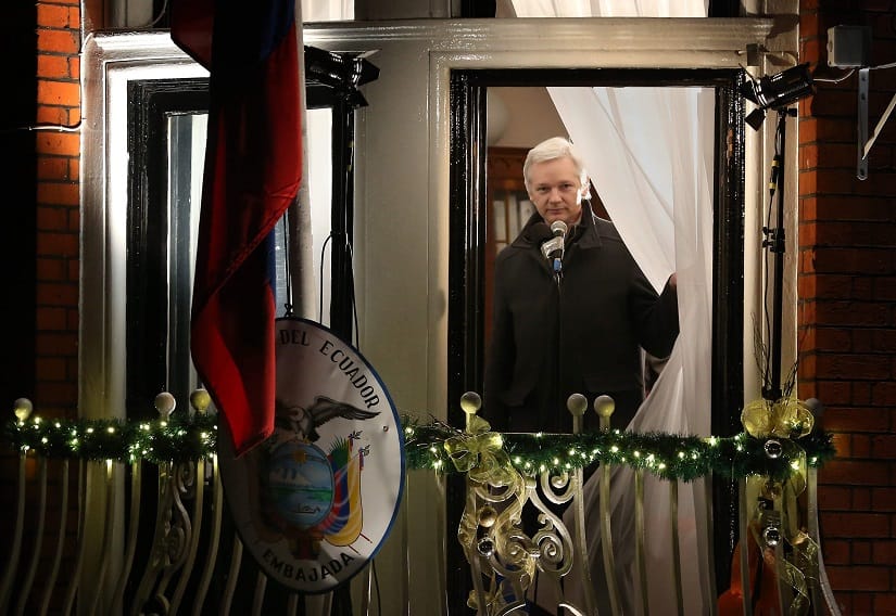 Julian Assange steps out of the balcony of the Ecuadorian embassy in London