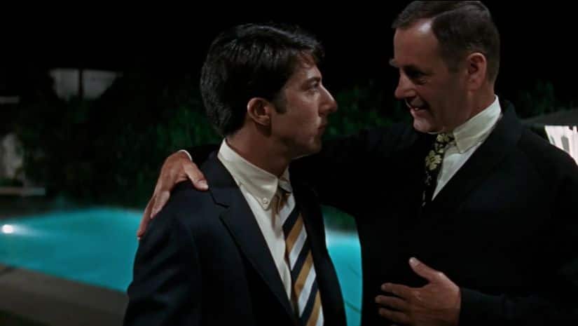 Ben (left) is clueless as Mr McGuire pulls him aside from the party