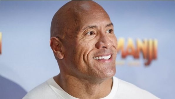 Watch: Dwayne Johnson gifts his custom truck to Navy veteran at Red Notice screening