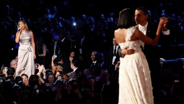 FILE - Beyonce, left, sings “At Last,” as President Barack Obama and first lady Michelle Obama have their first dance at an inaugural ball in Washington, Jan. 20, 2009. Inaugurations have long mirrored the nation’s cultural life. President-elect Joe Biden’s will feature Tom Hanks, Justin Timberlake and Jon Bon Jovi — remotely, in an age of illness and threats. (Damon Winter/The New York Times) 