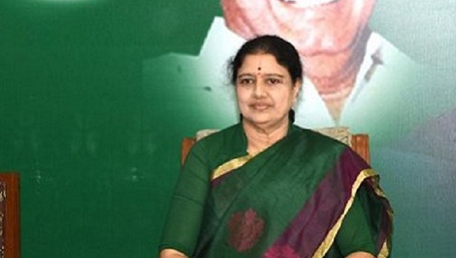 VK Sasikala returns to poll-bound Tamil Nadu after four years; arrives in a vehicle flaunting AIADMK flag VK Sasikala returns to poll-bound Tamil Nadu after four years; arrives in a vehicle flaunting AIADMK flag
