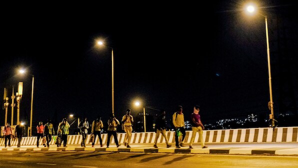 A year since India's COVID-19 lockdown, photographers talk us through their most defining images of the pandemic